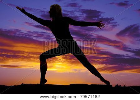 Silhouette Of A Woman Stretching Arms Out
