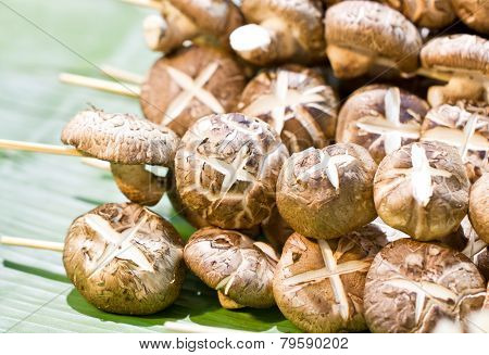 Shiitake Mushroom With Skewers On Banana Leaf.