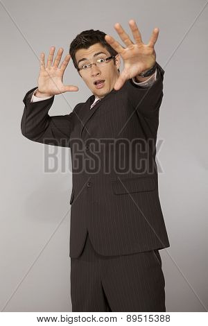 Young caucasian businessman suprised and affraid