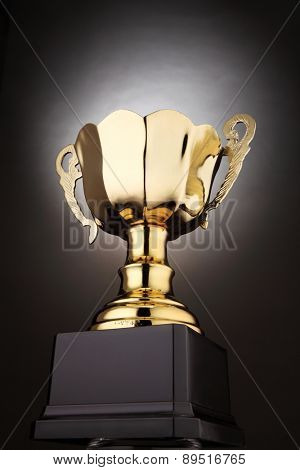 low angle of trophy with glow at the background
