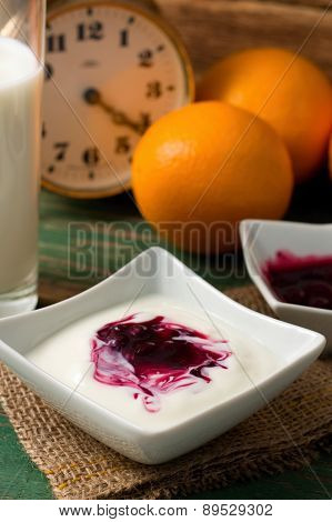 Table With Prepared Breakfast With Yogurth