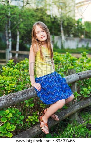 Summer portrait of a pretty little girl
