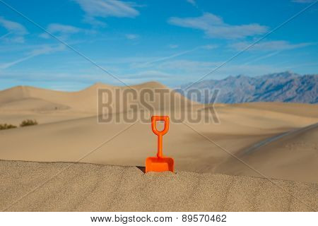 Plastic Shovel In A Sand Dune