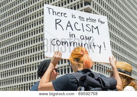 Woman Raising A Sign