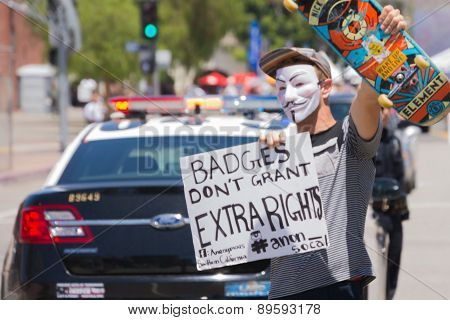 Masked Man Holding Poster
