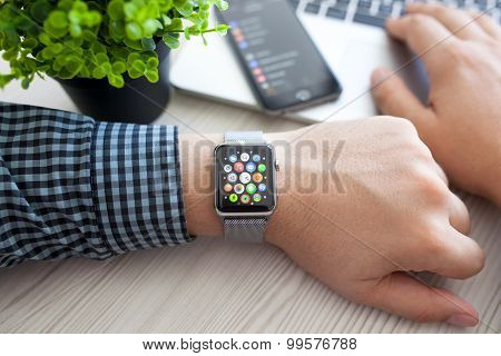 Man Hand With Apple Watch And App Icon On Screen