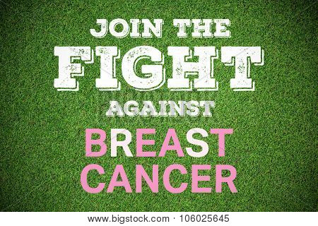 Breast cancer awareness message against close up view of astro turf