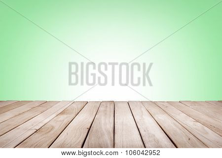 Wooden platform with green background.