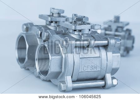 Group 3 valves different sizes ball valve with selective focus on thread fittings