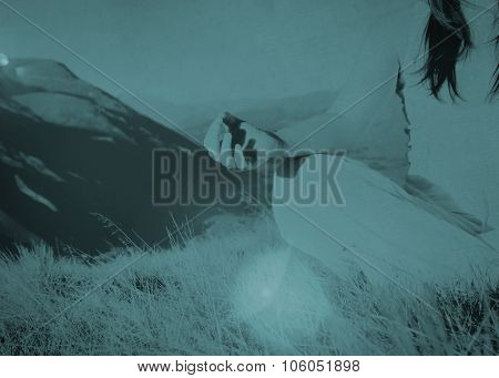 Lady meditating in lotus position on top of the mountain Concept