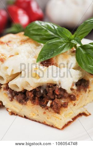 Pasticcio or pastitsio with ground beef and bechamel sauce, italian baked pasta