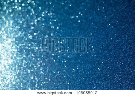 Blue Lights Festive Background. Abstract Holiday Twinkled Bright Background With Natural Bokeh Defoc