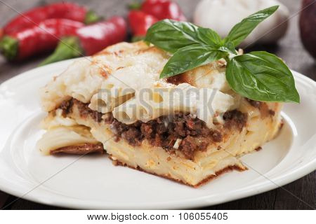 Pasticcio or pastitsio with ground beef and bechamel sauce, italian baked pasta