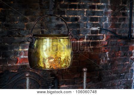 Single Antique vintage 1590 cauldron hand forged cooking pot hangged by the hearth fireplace old gol
