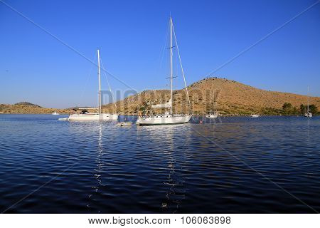 Two sailboats in the morning sun on the sea view from yacht Croatia