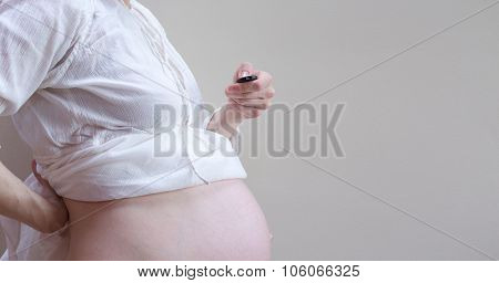A Belly Of A Pregnant Woman