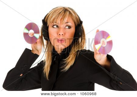 Woman Listening Music In Headphones And Holding Two Cd 