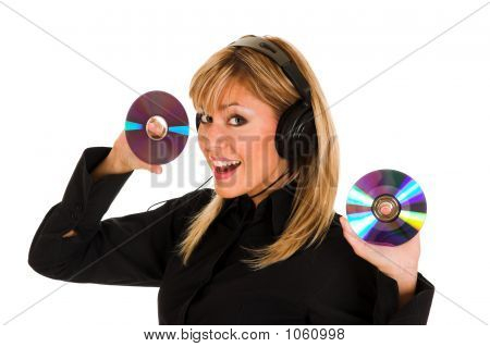 Woman Listening Music In Headphones And Holding Two Cd 