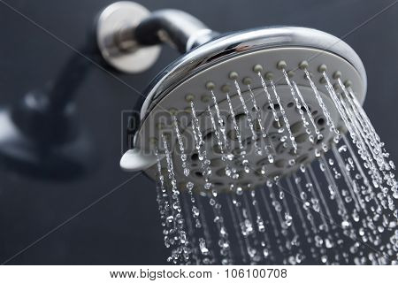 Shower Head In Bathroom With Water Drops Flowing
