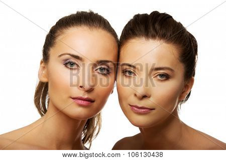 Two attractive sisters with make up.