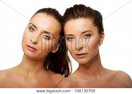 Two attractive sisters with make up.