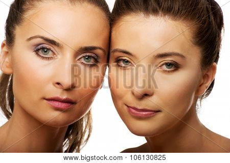 Two attractive sisters with make up.