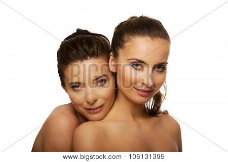 Two attractive sisters with make up.