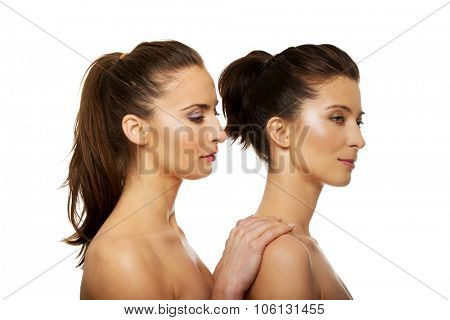 Beauty woman with make up standing behind her friend.