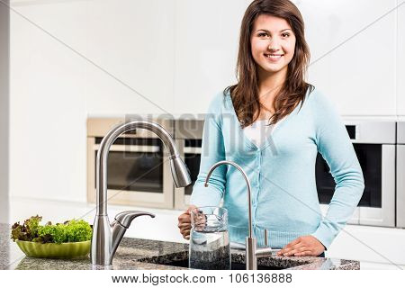 Woman Pouring Tap Water