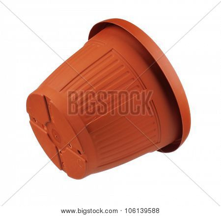 Empty garden plastic pot on a white background