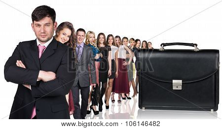 Black briefcase foreground and business peole