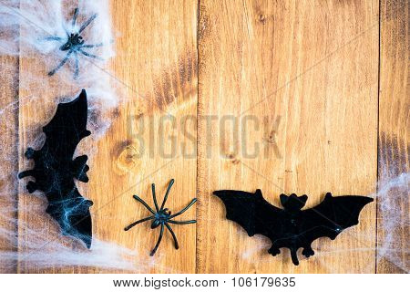 Halloween Symbols Bats, Web And Black Spiders On Wooden Background