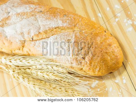 Bread And Wheat On The Wood Background, Warm Toning, Selective Focus