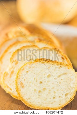 The Sliced Bread On A Wood Background, Warm Toning, Selective Focus