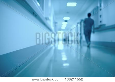 Moving human figure in the hospital corridor
