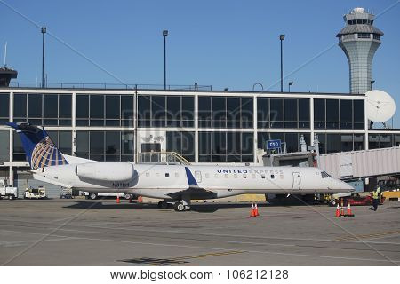 United Express Embraer plane on tarmac at O'Hare International Airport in Chicago