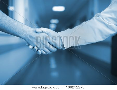 Handshake In The Hospital Corridor