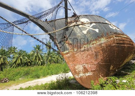 Rusty Old Pirate Ship On The Shore Of The Island. La Digue
