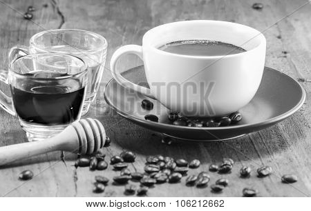 A Cup Of Coffee With The Honey On Black And White, Selective Focus