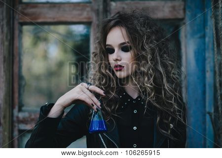 Vintage witch with elixir in hand