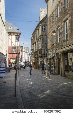 Medieval Cobbled Street In Dinan, Brittany, France