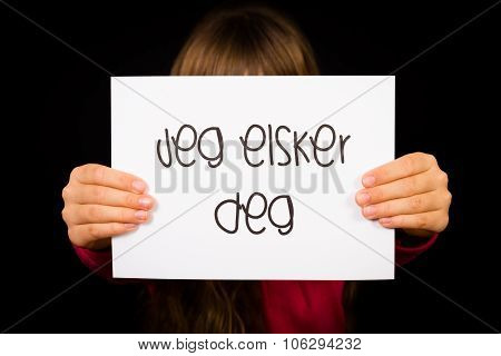 Child Holding Sign With Norwegian Words Jeg Elsker Dig - I Love You
