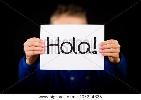 Child Holding Sign With Spanish Word Hola - Hello
