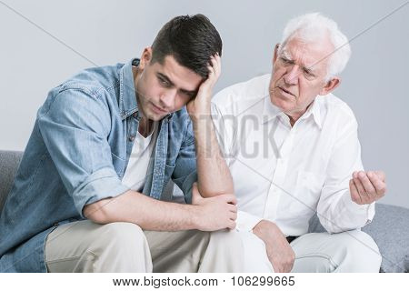 Troubled Man Talking With Father
