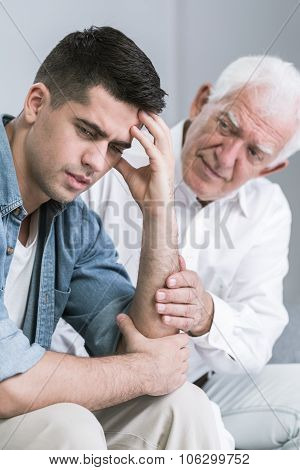 Father Comforting His Worried Son