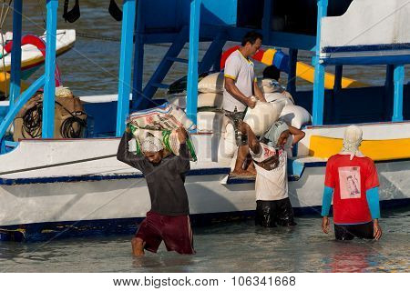 Men Transports Cargo From Ship