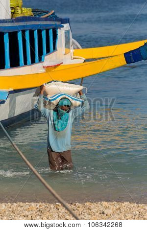 Men Transports Cargo From Ship
