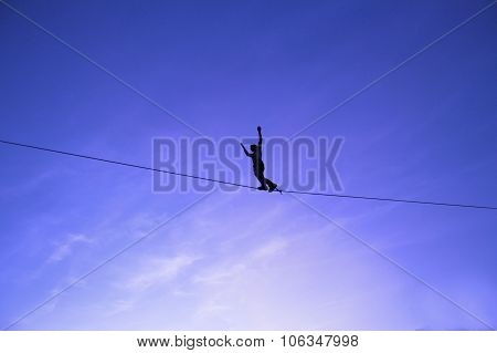 Men Balancing on Slackline