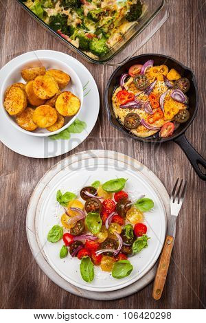 Tomato salad with grilled cheese and oven backed potatoes