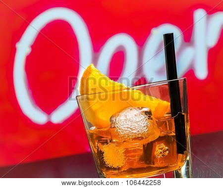 Detail Of Glass Of Spritz Aperitif Aperol Cocktail With Orange Slices And Ice Cubes On Bar Table, Di